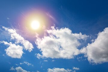 Sunny background with blue sky and sun as summer natural background.