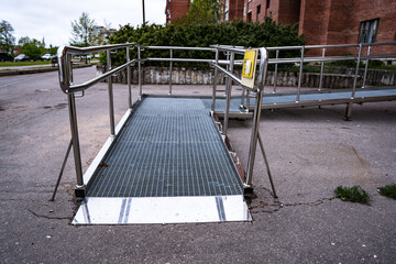 A ramp for people with disabilities near a public building.