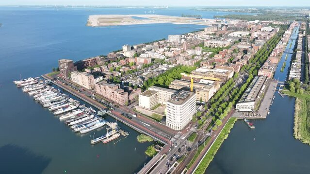 Amsterdam Ijburg artificial island modern residential area smart city cityscape at water Ijmeer. Urban houses buildings city environment area.