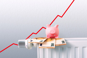 piggy bank, rising graph and money bank notes on radiator, heating costs on the rise