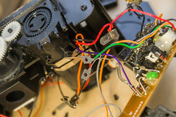Repair of consumer electronics. Workflow in the workshop of electrical appliances. Electronic components and parts disassembled. Selective focus, background