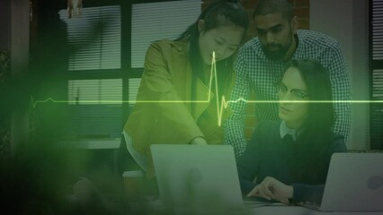 Animation of cardiograph over diverse business people using laptop - Powered by Adobe