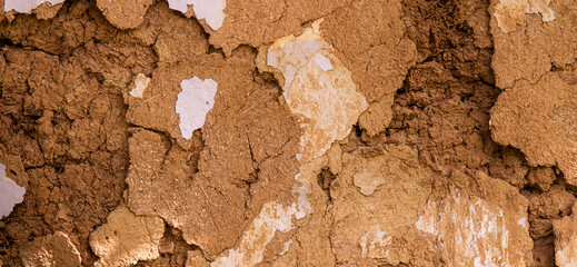 Texture of cracked light brown clay for background