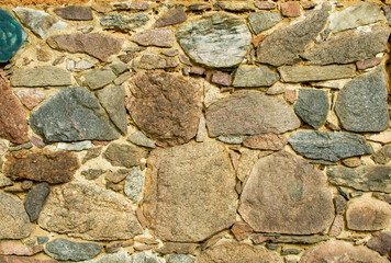 old wall made of colorful field stones