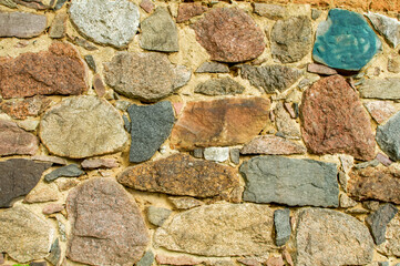 old wall made of colorful field stones