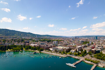Aerial view of Lake Zürich at City of Zürich with local mountain Uetliberg in the background on a sunny spring day. Photo taken May 30th, 2022, Zurich, Switzerland.