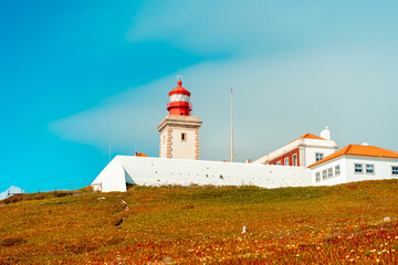 Fototapeta na wymiar View of the Cabo da Roca Lighthouse. Sintra, Portugal. Portuguese Farol de Cabo da Roca is a cape which forms the westernmost point Eurasian