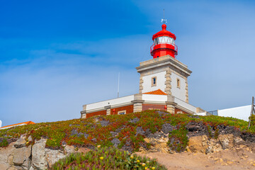 Fototapeta na wymiar View of the Cabo da Roca Lighthouse. Sintra, Portugal. Portuguese Farol de Cabo da Roca is a cape which forms the westernmost point Eurasian