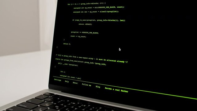 Developer is browsing html code on the computer screen. Scroll of HTML Web Page Code. Programming code abstract technology background. Computer script concept. High quality 4k footage
