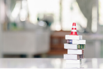 Effective safety training and refresher training concept : White-orange traffic cone, safety or a...