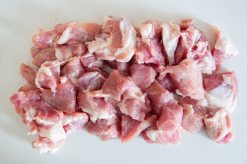 raw pork chops on white