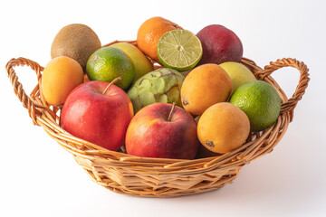 Nice wicker basket full of fresh and varied fruit