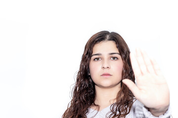 young brunette woman on white background commanding to stop