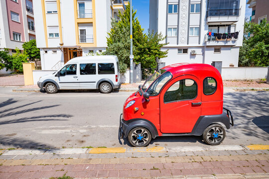 20 May 2022, Antalya, Turkey: Chinese Regal Raptor Motors model K5 mini electric car parked at the city street. Tiny and funny modern eco transport