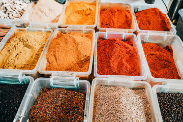 Various seasonings and spices on the counter in the market