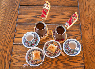 Obraz na płótnie Canvas Turkish coffee and baklava on the wooden table