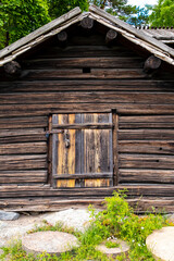 Fototapeta na wymiar Wooden, vintage log shed in the countryside.