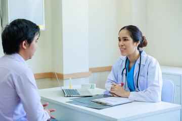 Fototapeta premium Asian woman doctor and asian man patient. Smiling female doctor talking consulting with patient Hospital Healthcare and medicine concept.