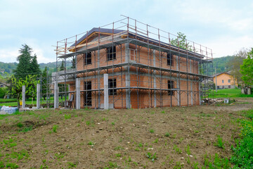 Fototapeta na wymiar House in construction close-up. Building construction site. Construction works