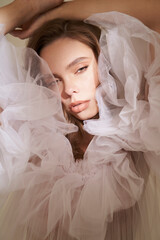 Beautiful woman pose in studio in classic wedding dress - 510604396