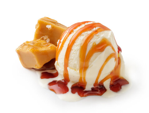 Ice cream ball with caramel cubes and caramel sauce on white. Ice cream isolated.