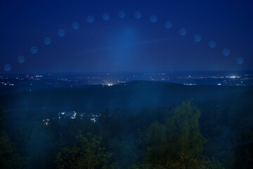 Night sky over the Bavarian Forest in a mountainous landscape