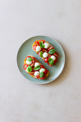 Bruschetta with mozzarella, tomatoes and basil. Vegetarian food. Healthy eating.