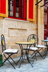 Chairs and table on empty terrace at cafe .