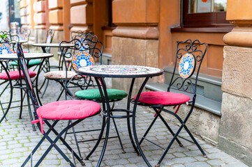 Chairs and table on empty terrace at cafe .