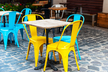 Fototapeta na wymiar Chairs and table on empty terrace at cafe .