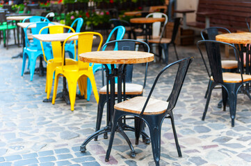 Chairs and table on empty terrace at cafe .