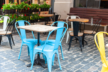 Fototapeta na wymiar Chairs and table on empty terrace at cafe .