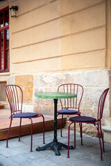 Chairs and table on empty terrace at cafe .