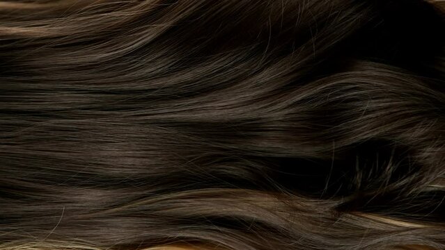 Super slow motion of wavy brown hair in detail. Filmed on high speed cinema camera, 1000 fps.