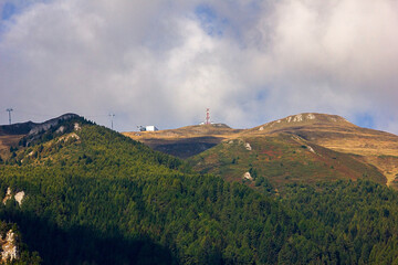 epic sky over green mountains slopes