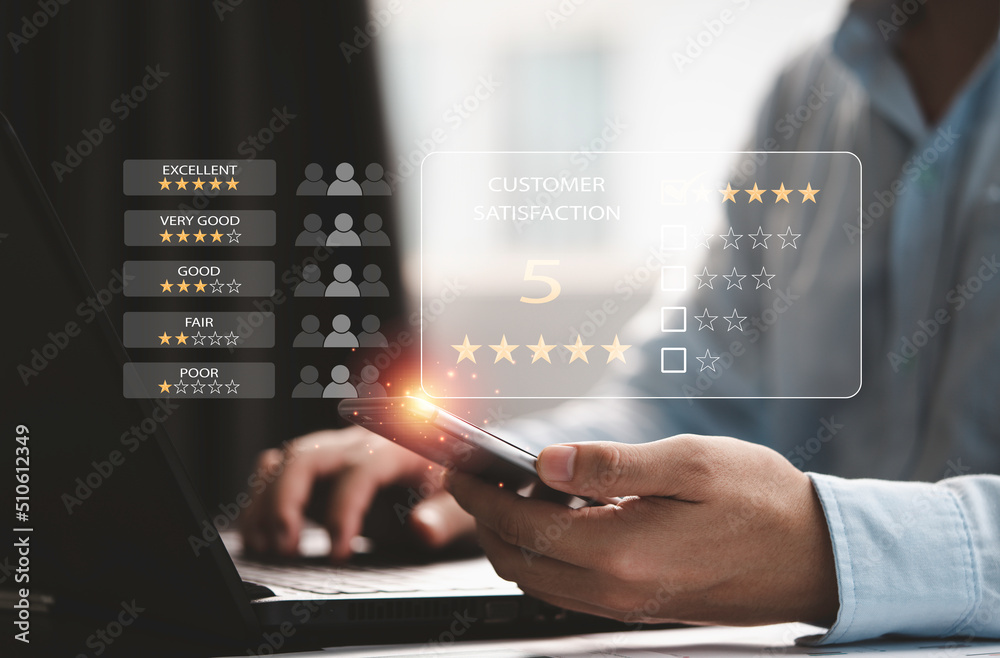 Poster customer satisfaction survey concept, businessman using computer laptop and smartphone to select exc