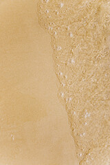 Wave on wet sand, beach vacation, summer time. The concept of tourism, recreation, spa