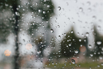 Close-up of Rain drops in front of the car mirror