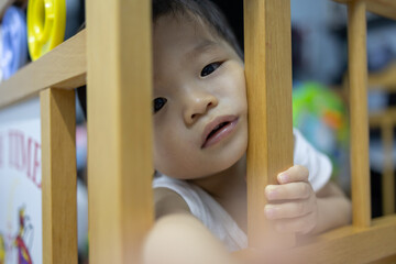 Portrait image of​ 1-2 years old​ childhood​ child. Face of relax and happy Asian​ boy in head shot.