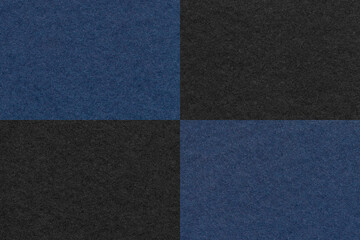 Fototapeta premium Texture of craft navy blue and black paper background with cells pattern, macro. Structure of vintage kraft cardboard.
