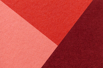 Fototapeta premium Texture of craft red, wine and pink shade color paper background, macro. Abstract cardboard with gradient