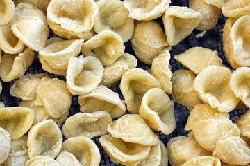 Close-up image of fresh handmade Apulian orecchiette pasta. Typical Italian pasta recipe