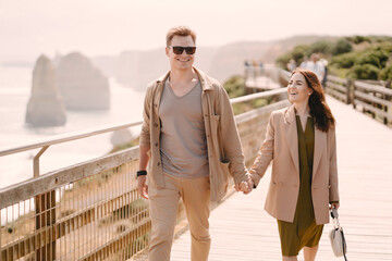 Couple on vacation wlking on a bridge