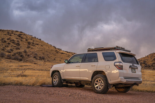 Fort Collins, CO, USA - March 31, 2022: Toyota 4Runner SUV at a trailhead in Soapstone Prairie Natural Area in Colorado foothills, early spring scenery.