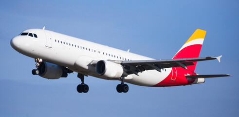 a passenger plane is flying through the sky