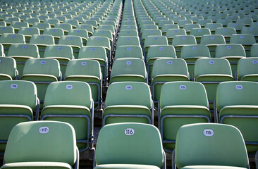 Fototapeta premium Empty Plastic Chairs at the Stadium