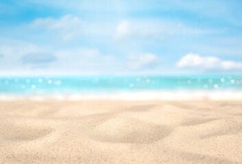 Summer vacation or holiday background. Tropical beach with sand, sea and sun in sky. Selective focus on sand. Can be used as background for product montage