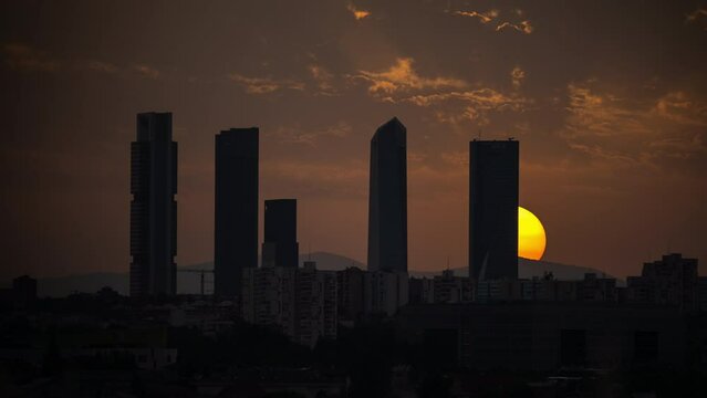 Timelapse of sunset behind the Four Tower in Madrid, Spain 