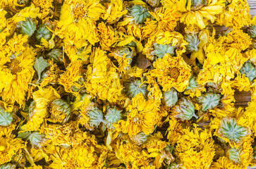 Dried Chrysanthemum tea textured as background.