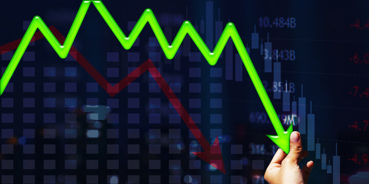 Businessman hand holding falling arrow